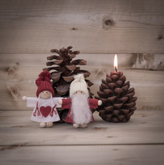 Obraz premium Merry Christmas - Tiny Christmas Figurines & Wooden Background
