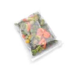 Plastic bag with frozen vegetables on white background