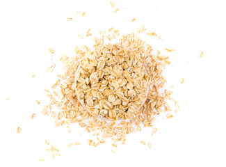 Top view of oat flakes in the cup on isolated background.