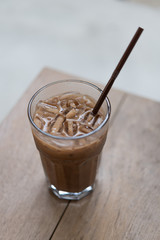 Close up shot of Ice latte on wooden table in coffee shop