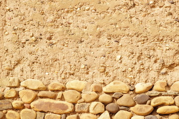 boulders in old mud house , background or texture
