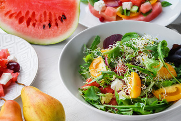 Plate with delicious watermelon salad on white table