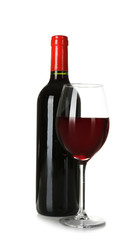 Bottle and glass of red wine on white background