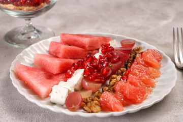 Plate with delicious watermelon salad on table, closeup