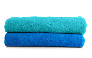 Stack of colorful towels on white background