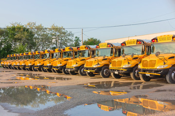 Yellow school buses lined up in the depot on the weekend.USA.