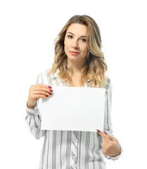 Naklejka premium Portrait of beautiful young woman with blank paper sheet on white background
