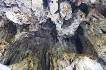 Formations inside cave with stalactites and stalagmites