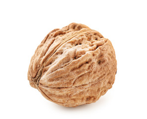 Unpeeled walnut on white background