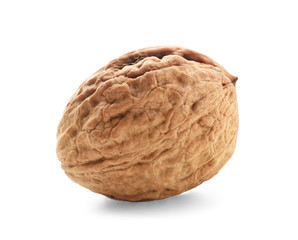 Unpeeled walnut on white background