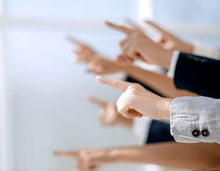 hands of business people pointing to copy space