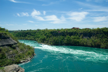 NIAGARA FALLS, ONTARIO, CANADA - MAY 21st 2018: Whirlpool Aero car carrying riders across the Niagara Whirlpool