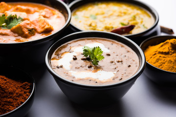 Indian Lunch / Dinner main course food in group includes Paneer Butter Masala, Dal Makhani, Palak Paneer, Roti, Rice etc, Selective focus