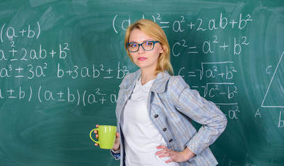 Keep positive attitude to work. Woman with tea cup chalkboard background. Prevent burnout concept. Time to relax. Teacher drink tea or coffee and stay positive. Find time to relax and stay positive