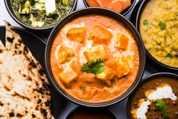 Paneer Butter Masala or Cheese Cottage Curry in serving a bowl or pan, served with or without roti and rice