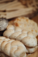 Freshly baked bread loaves dark wooden background. closeup italian bakery products