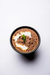 Dal Tadka Fry / Indian Lentil Curry served in a bowl with rice and roti, selective focus