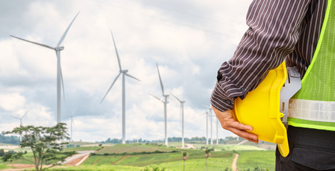 Engineer worker at wind turbine power station construction site © Kwangmoozaa