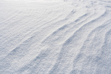 White winter wavy snowy background of snow.