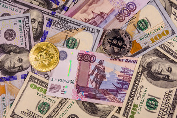 Bitcoin coins on the american and russian banknotes