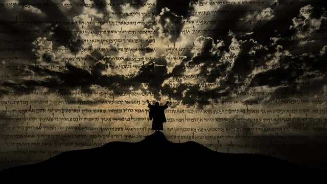 Silhouette of Jesus praying on hill. Ink transition animation effect with text of the old prophecy.
