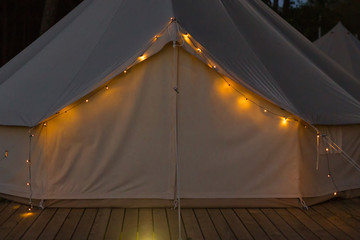 Close-up of glamping bell tent at night