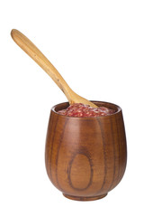 jam of red fig in wooden cup isolated