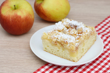 apple cake and apples on table