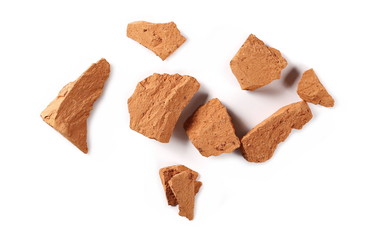 Shattered bricks isolated on white background, top view