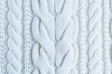 The texture of white yarn. Knitted and winter clothes