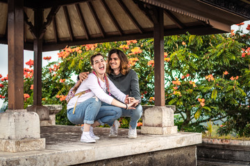 Young couple of tourists in abandoned hotel on the north of Bali island, Indonesia.