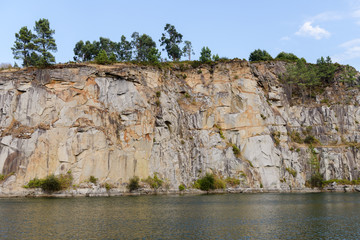 Fototapeta na wymiar landscape, trees on the rocks above the water