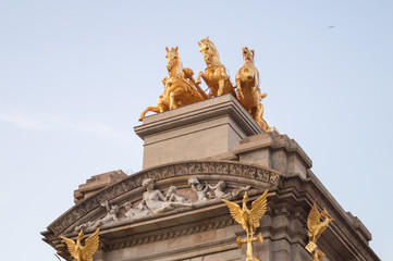 Fototapeta na wymiar The golden horse figures of the Cascada Monumental in the Ciutadella Park or Parc de la Ciutadella in Barcelona, Spain.