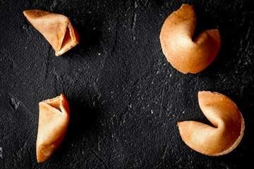 Chinese fortune cookie with prediction on dark background top vi