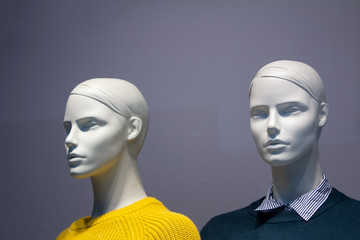 Head of two man and girl white mannequin on a gray background.