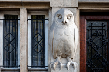 An owl sculpture on an entrance of a building in Brussels, Belgium