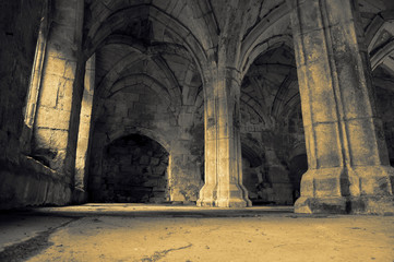 Abstract image of the interior of a medieval abbey with colour toning