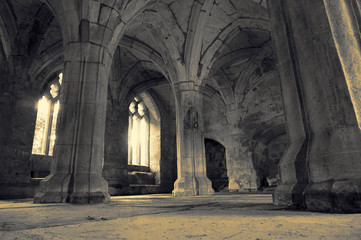 Abstract image of the interior of a medieval abbey with colour toning