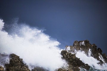 Dramatic big stormy crashing waves splash. Kleinmond, Western Cape, South Africa.