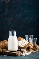 Fresh coconut milk in glass bottle, vegan non dairy healthy drink © Sea Wave