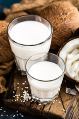 Fresh coconut milk in glass, vegan non dairy healthy drink