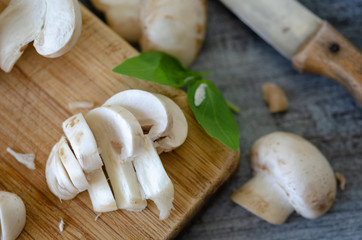 Natural organic raw mushrooms of sliced   on table