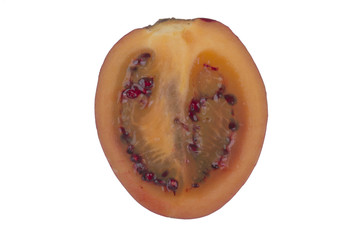half of tamarillo isolated on white background