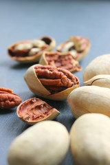 Pecan nuts on a wooden table close-up. Healthy food, healthy lifestyle, diet, vegetarianism.
