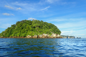 Fototapeta na wymiar Little island in the blue waves. Hat Noppharat Thara-Mu Ko Phi Phi National Park
