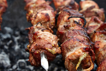 Meat roasted on fire barbecue grill