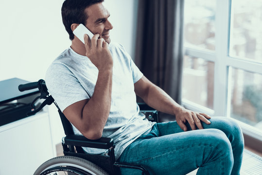 Handicapped Person In Wheelchair Talking Phone