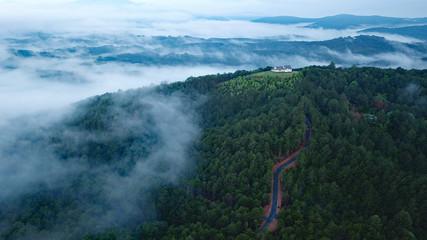 Aerial view of a white house in the clouds