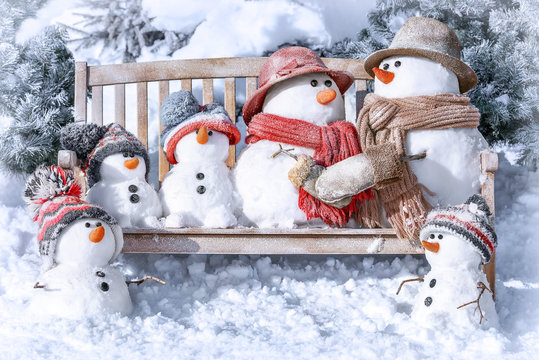 Postcard with Christmas and a new year with  cute snowmen