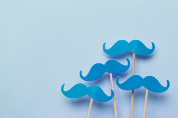 Blue moustache on a Blue background. Prostate cancer awareness month - obrazy, fototapety, plakaty